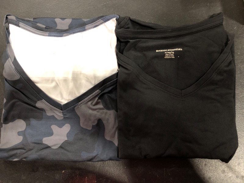 Photo 1 of black v neck shirt and camo v neck shirts size XL.