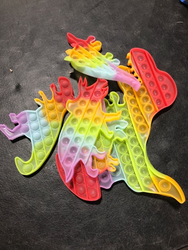 Photo 2 of Dinosaur Toys Party Favors for Kids, Fidget Toy Pop Its Bulk Pack, Stocking Stuffers Sensory Toys Autistic Children Autism ADHD Boys Girls, Treasure Prize Box Fidgets Popit Classroom Small Stress Gift