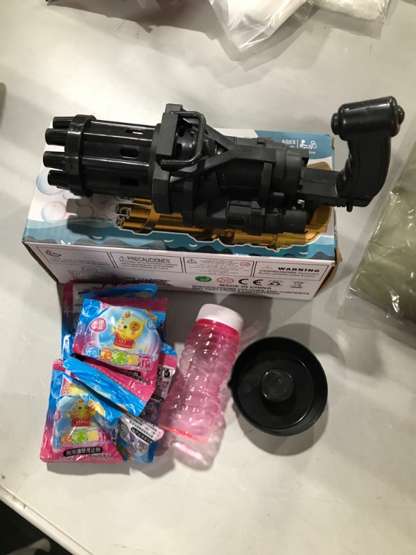 Photo 2 of Electric Bubble Gun, Bubble Maker Bubble Machine W/ 100ML Bubble Solution 2022 Upgrade 8-Hole Bubble Blower Automatic Bubble Machine Outdoor Toy for Boys Girls Black