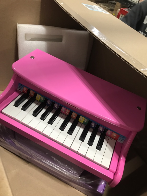 Photo 1 of Melissa & Doug Learn-to-Play Pink Piano With 25 Keys and Color-Coded Songbook