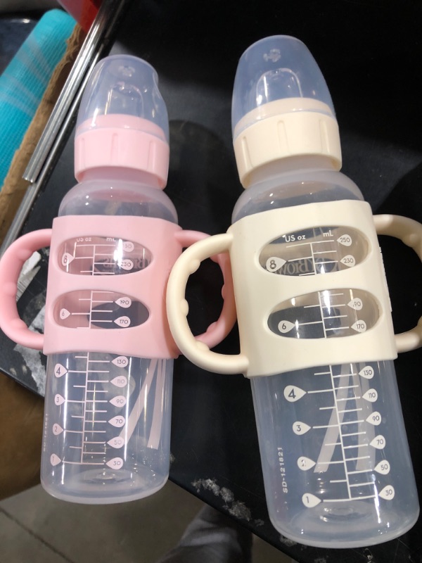 Photo 2 of Dr. Brown’s® Milestones™ Narrow Sippy Bottle with 100% Silicone Handles, Easy-Grip Bottle with Soft Sippy Spout, 8oz/250mL, BPA Free, Light-Pink & Ecru, 2 Pack, 6m+ 2 Pack, Light Pink & Ecru