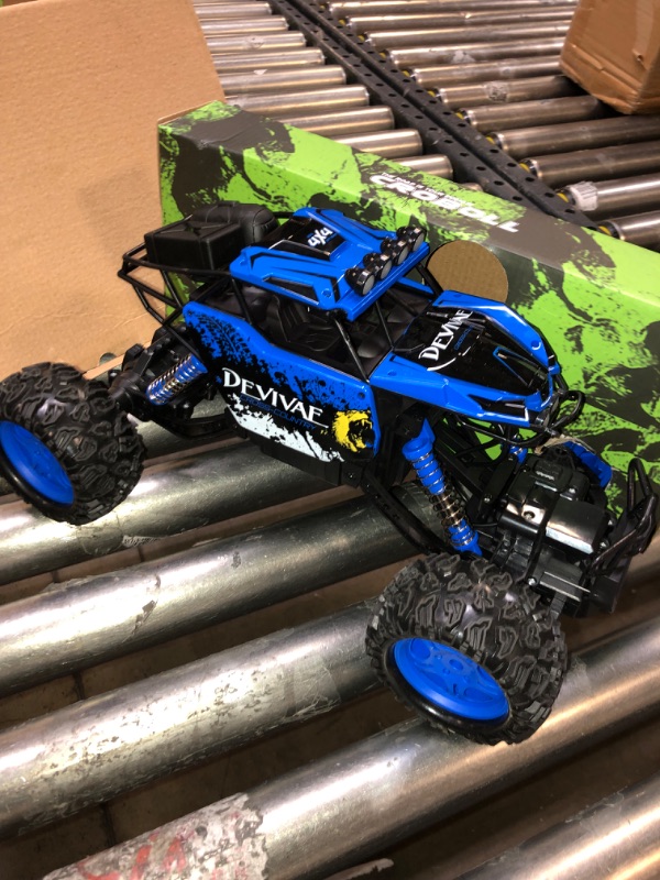 Photo 2 of CROBOLL 1:12 Large Remote Control Car for Boys Kids with Lifting Function,4WD RC Cars Electric Monster Truck Toy Gifts 4X4 Off-Road RC Rock Crawler 2.4GHz All Terrain RC Truck with 2 Batteries(Blue)