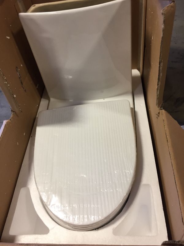 Photo 2 of St. Tropez One Piece Elongated Toilet Right Side Flush 1.28 gpf Glossy White Right Flush Toilet