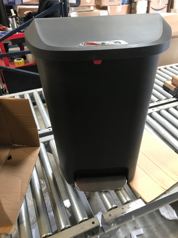 Photo 2 of Amazon Basics Tall Kitchen Plastic Trash Can with Steel Pedal, Black, 50-Liter 50 Liter Wide Black USED CRACKED ON BOTTOMA ND FOOT LEVER DOES NOT WORK