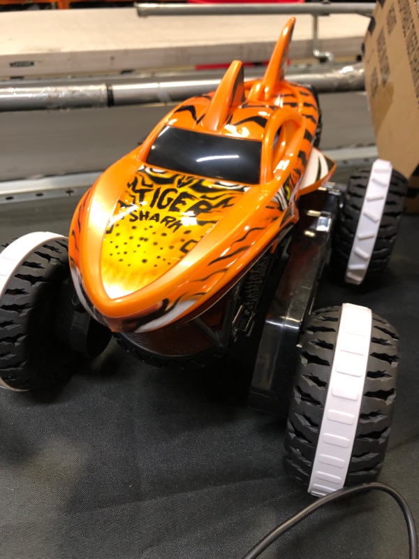 Photo 1 of Hot Wheels Monster Trucks, Remote Control Car, Monster Truck Toy with All-Terrain Wheels, 1:15 Scale Unstoppable Tiger Shark RC