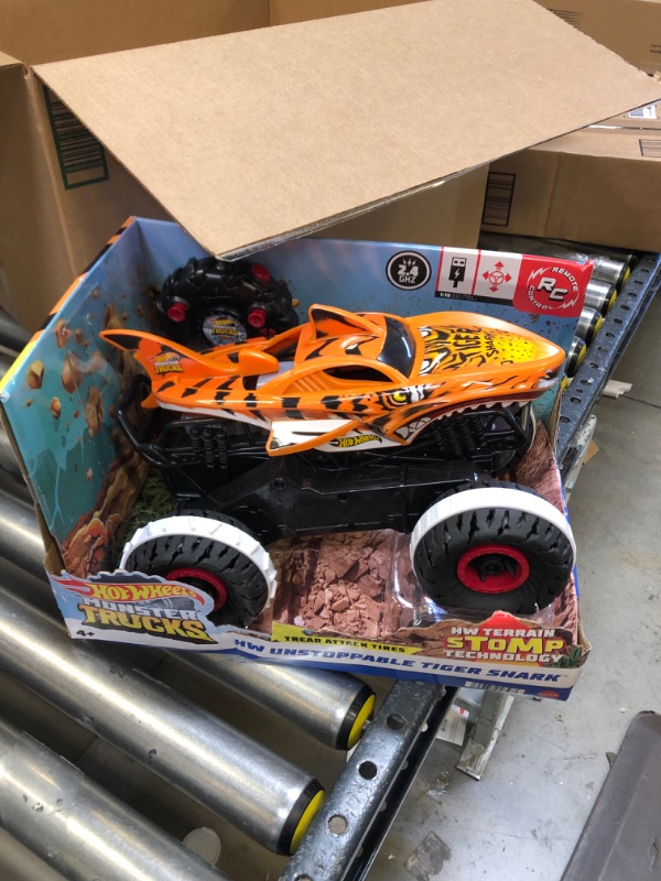 Photo 3 of Hot Wheels Monster Trucks, Remote Control Car, Monster Truck Toy with All-Terrain Wheels, 1:15 Scale Unstoppable Tiger Shark RC