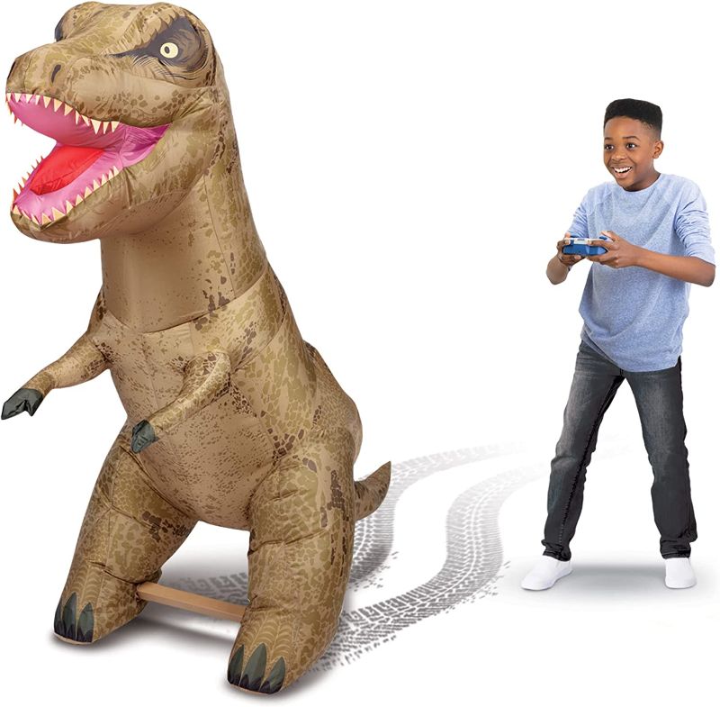 Photo 1 of AIRTITANS Jurassic World Inflatable T Rex RC – Massive Attack Air Titans Dinosaur - Over 6 Feet Long - Turns & Spins - Stomps & Roars! - UNABLE TO TEST 
