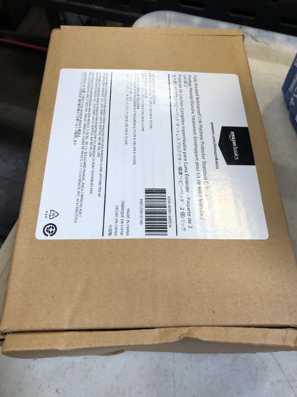 Photo 2 of Amazon Basics Waterproof Zippered Standard Crib (28" x 52") Mattress Protector Encasement, 2-Pack Standard Crib (28" x 52") 2-Pack