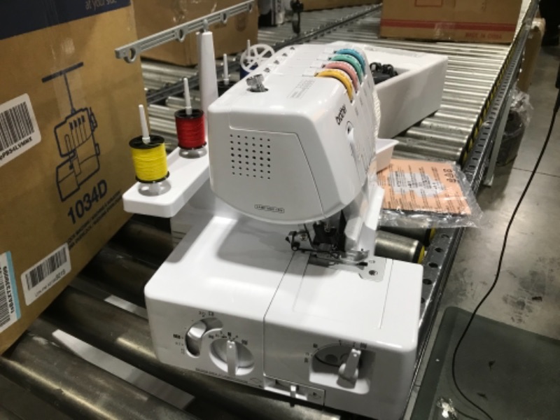 Photo 6 of  Brother Serger, 1034D, Heavy-Duty Metal Frame Overlock Machine, 1,300 Stitches Per Minute, Removeable Trim Trap, 3 Included Accessory Feet,White 