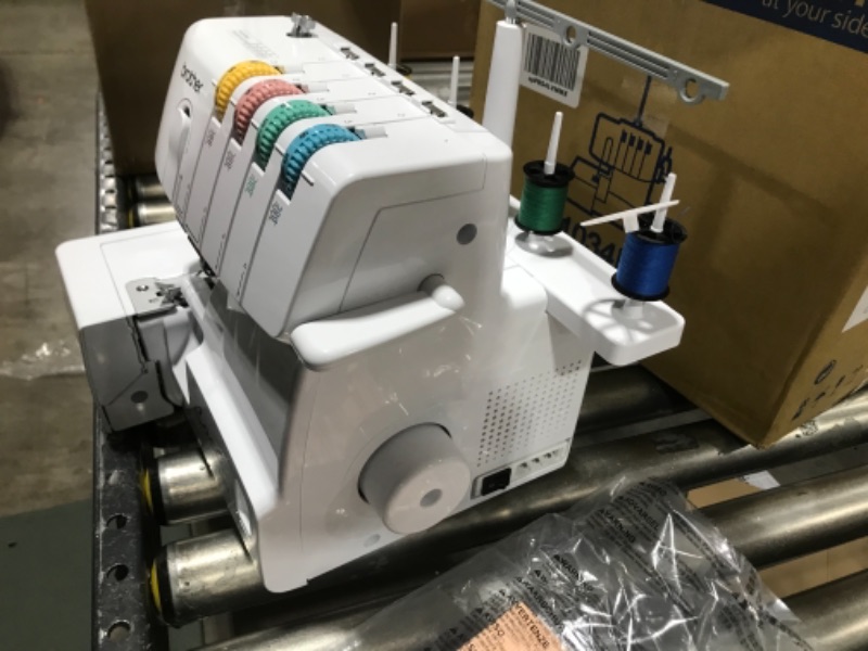 Photo 5 of  Brother Serger, 1034D, Heavy-Duty Metal Frame Overlock Machine, 1,300 Stitches Per Minute, Removeable Trim Trap, 3 Included Accessory Feet,White 