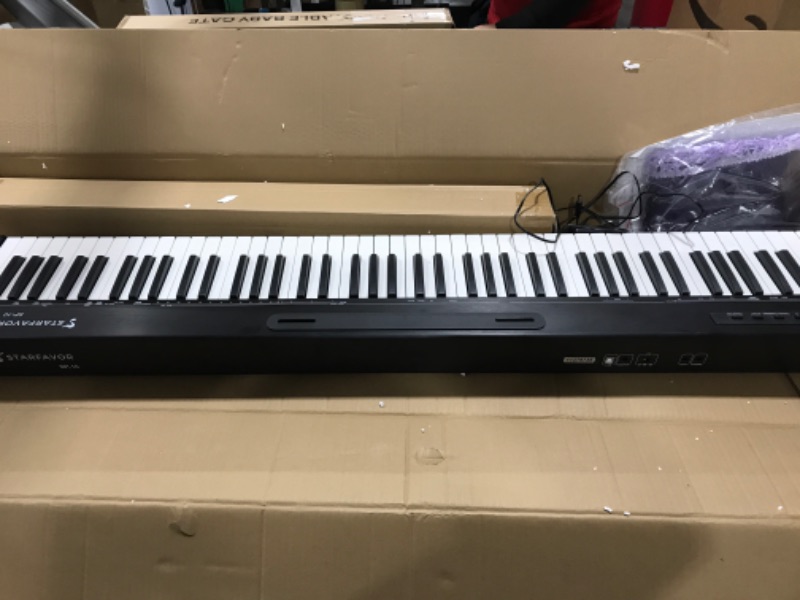 Photo 2 of *incomplete* Starfavor 88 Key Digital Piano Beginner Electric Keyboard Full Size with Semi Weighted Keys Dual 30W Speakers SP-10 Bundle include Sustain Pedal, Power Supply, Stand, Piano Stickers -- scuffs, missing parts 
