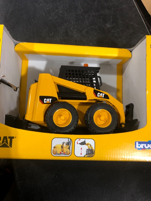 Photo 2 of Bruder 09047 Caterpillar Skid Steer Loader with Accessories 02482 with accessories