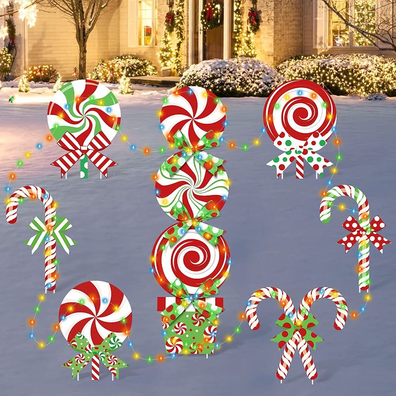 Photo 1 of 10 Pack Christmas Candy Cane Yard Signs with LED Lights Without Batteries Lollipop Front Back Garden Patio Lawn Topper Winter Holiday Peppermint Green White Red Bows Indoor/Outdoor Xmas Decorations
