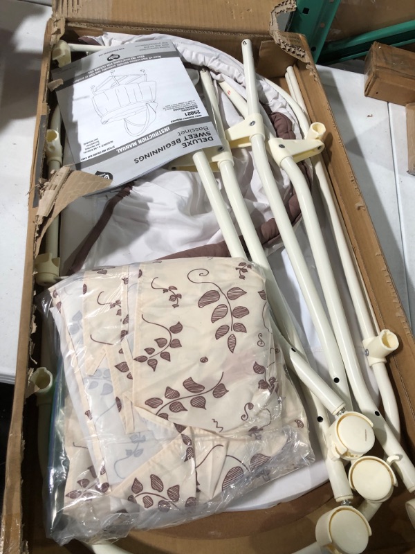 Photo 2 of Delta Children Deluxe Sweet Beginnings Bedside Bassinet - Portable Crib with Lights and Sounds, Falling Leaves Falling Leaves Bassinet