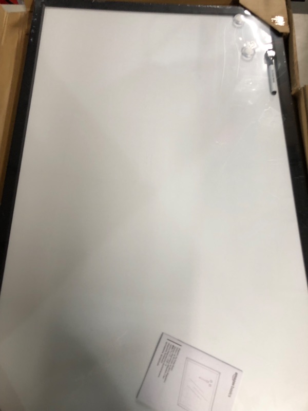 Photo 1 of Amazon Basics Magnetic Dry Erase White Board, 35 x 23-Inch Whiteboard - Black Wooden Frame 23"x35" Magnetic, Wood Frame