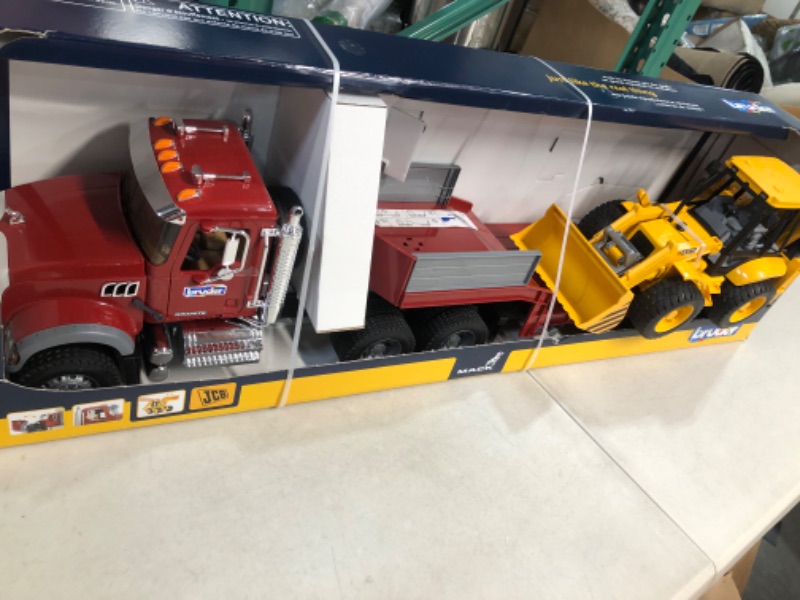 Photo 1 of Bruder Toys 02813 Mack Granite Flatbed Truck with JCB Loader Backhoe