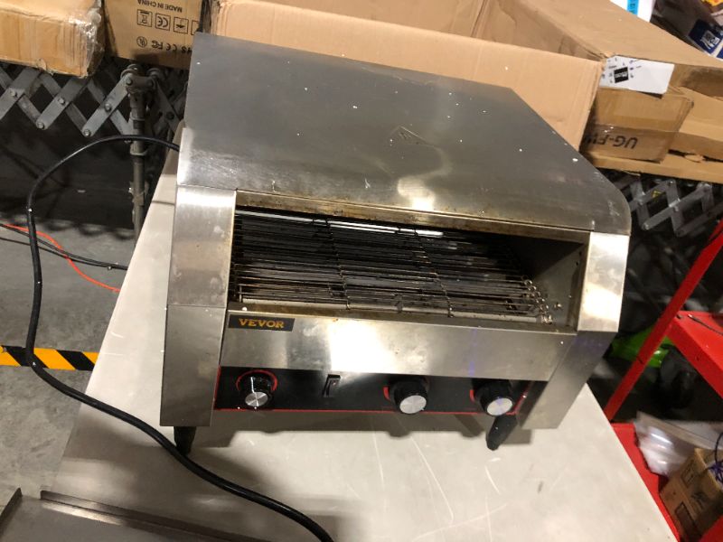 Photo 2 of ***MAJOR DAMAGE - NONFUNCTIONAL - BURNT - SEE PICTURES - FOR PARTS***
VEVOR 450 Slices/Hour Commercial Conveyor Toaster,2600W Stainless Steel Heavy Duty Industrial