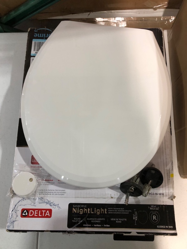 Photo 3 of -USED-Delta -Faucet 833902-N-WH Sanborne Elongated Potty Training Nightlight Toilet Seat with Slow Close and Quick-Release, White