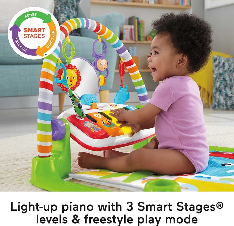 Photo 1 of Fisher-Price Deluxe Kick & Play Piano Gym, Baby Activity Playmat With-Toy Piano, Lights, Music And Smart Stages