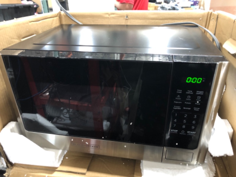 Photo 2 of (USED) Farberware Countertop Microwave 1.1 Cu. Ft. 1000-Watt Compact Microwave Oven with LED lighting, Child lock, and Easy Clean Interior, Stainless Steel Interior & Exterior***********USED AND DIRTY*************