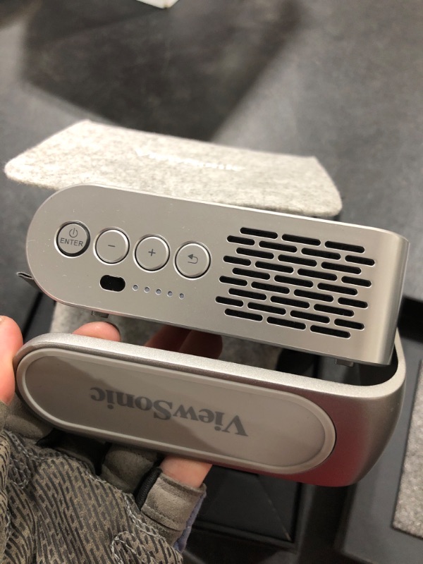 Photo 1 of ViewSonic M1 Portable LED Projector with Auto Keystone, Dual Harman Kardon Speakers, HDMI, USB C, Stream Netflix with Dongle Portable Portable Projector