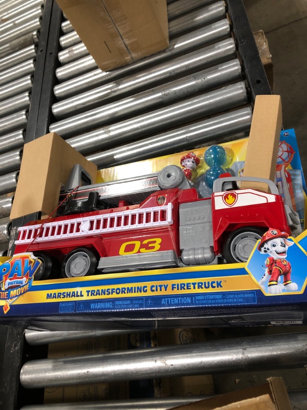 Photo 2 of Paw Patrol, Marshall’s Transforming Movie City Fire Truck with Extending Ladder, Lights, Sounds and Action Figure, Kids Toys for Ages 3 and up