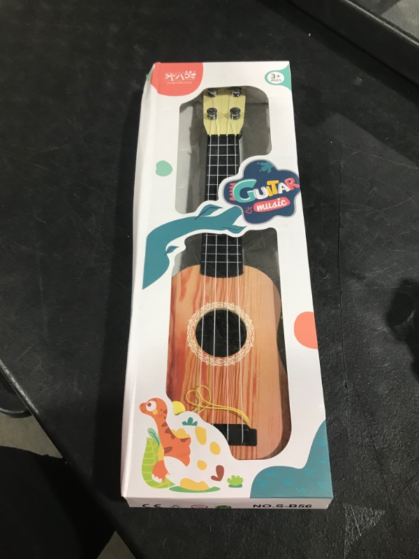 Photo 2 of YOLOPLUS+ Kids Guitar Toy 17 inch Ukulele Guitar Four Strings Mini Guitar Classical Musical Instrument for Toddler Baby Boys Girls Early Educational Learning, Wooden Color 17 inch Spruce wood color