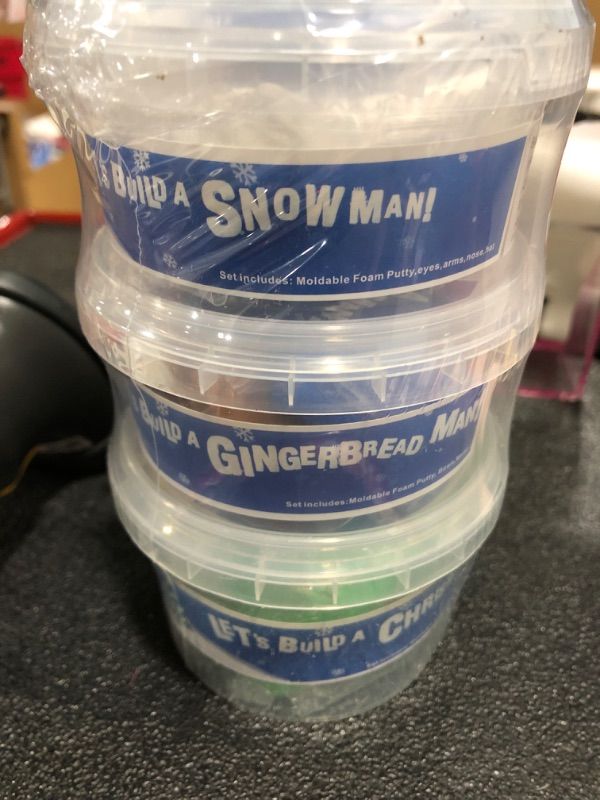 Photo 1 of A 3 piece kit of molds/putty for creating a snowman, gingerbread man, and Christmas tree