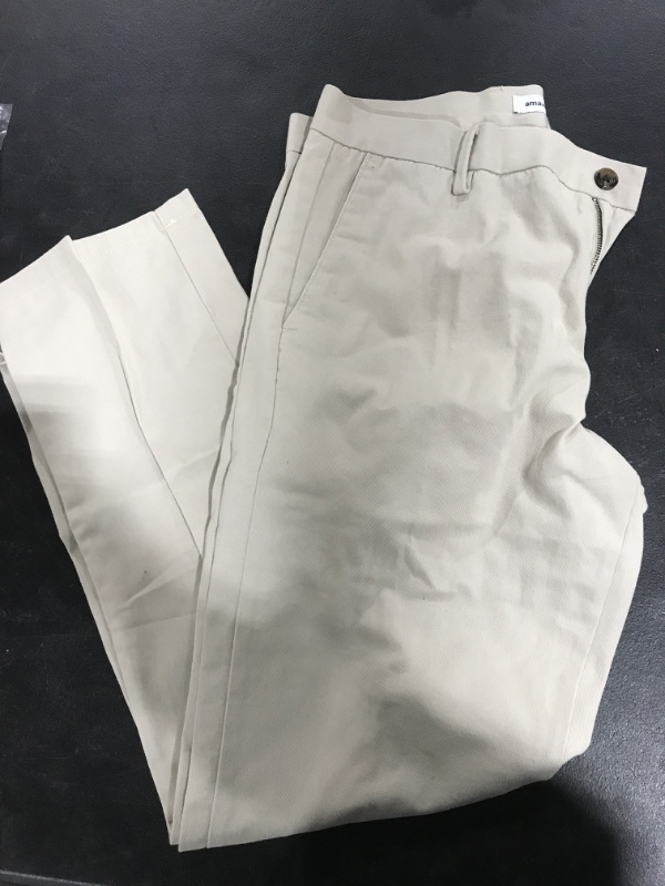 Photo 1 of Amazon Essentials Men's Slim-Fit Wrinkle-Resistant Flat-Front Chino Pant 33W x 30L Stone