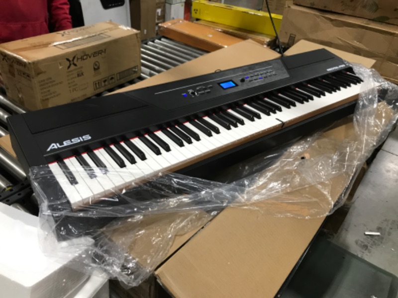 Photo 2 of Alesis Recital Pro - 88 Key Digital Piano Keyboard with Hammer Action Weighted Keys, 2x20W Speakers, 12 Voices, Record and Lesson Mode, FX and Display

