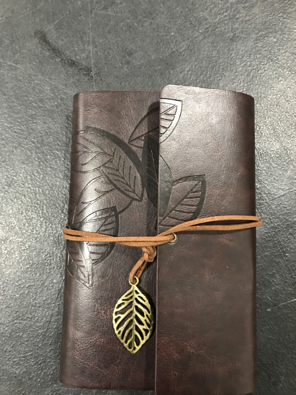 Photo 1 of brown leather bound spiral notebook 