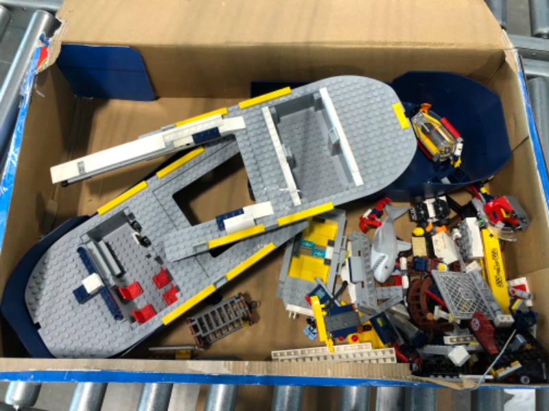 Photo 2 of LEGO City Ocean Exploration Ship 60266, Toy Exploration Vessel, Mini Helicopter, Submarine, Shipwreck with Treasure, Lifeboat, Stingray, Shark, Plus 8 Minifigures (745 Pieces)