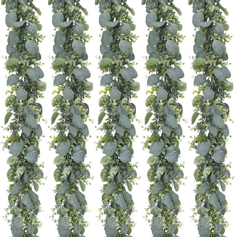 Photo 1 of CEWOR 5pcs 5.5ft Artificial Eucalyptus Garland Fake Silver Dollar Eucalyptus Greenery Garland Vines Table Runner for Wedding Arch Backdrop Table Centerpiece Home Mantle Decor
