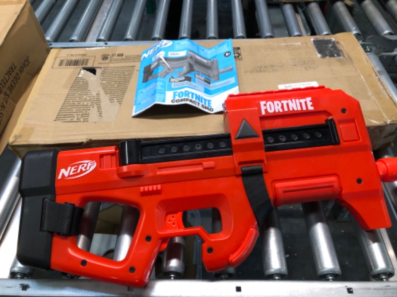 Photo 1 of NERF Fortnite Compact SMG Motorized Blaster, Ultra Red Wrap Design, 8-Dart Internal Clip, Electric Semi Auto Fortnite Toy Blaster