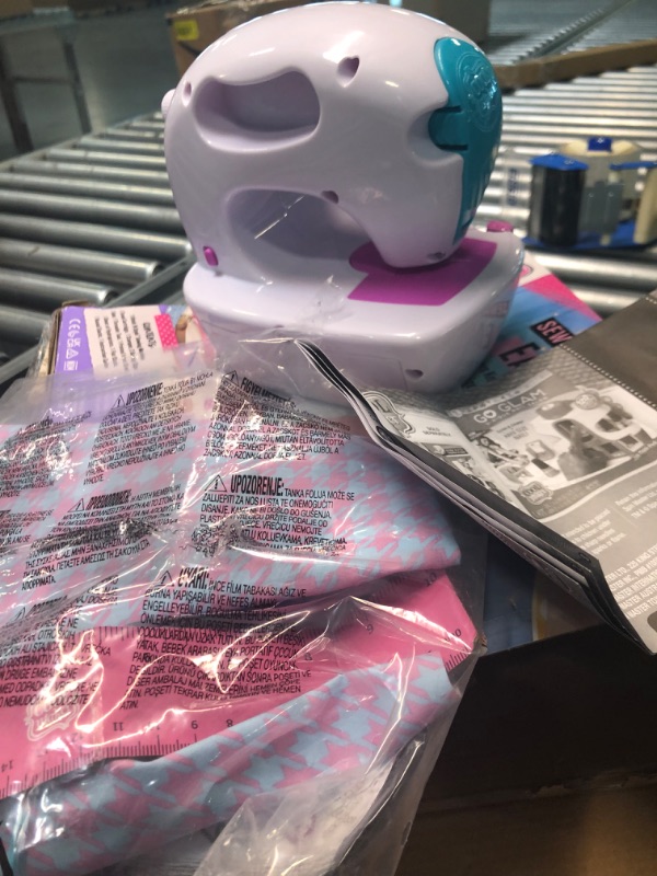 Photo 1 of Cool Maker, Stitch ‘N Style Fashion Studio, Pre-Threaded Sewing Machine Toy with Fabric and Water Transfer Prints, Arts & Crafts Kids Toys for Girls