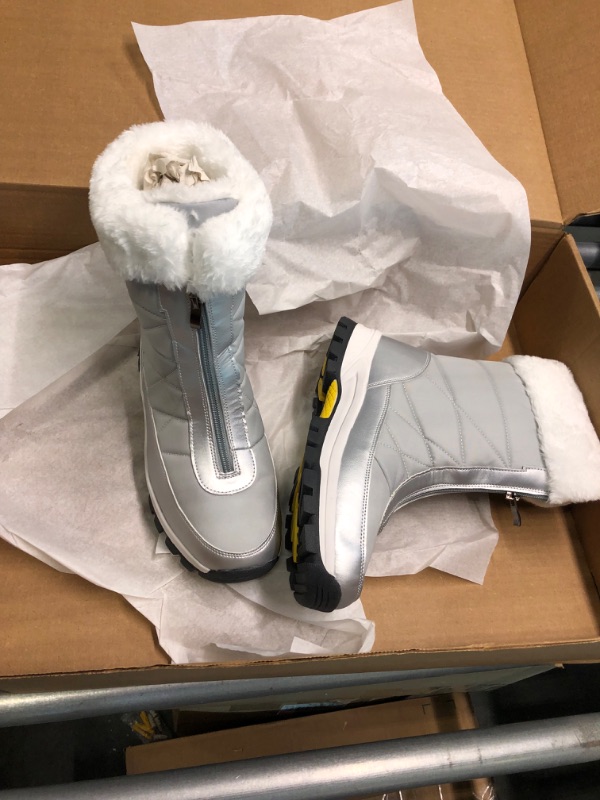 Photo 4 of silver and white with yellow bottom furry snow boots --- Unknow Size ---