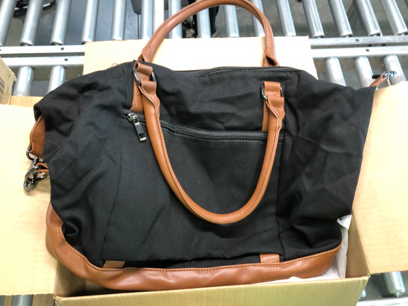 Photo 3 of Medium black Fabric bag with zip and brown leather straps. 