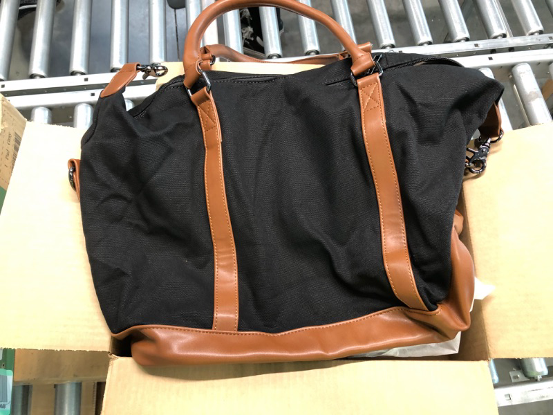 Photo 4 of Medium black Fabric bag with zip and brown leather straps. 