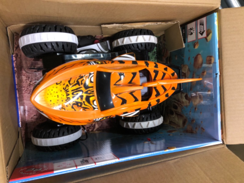 Photo 3 of Hot Wheels Monster Trucks, Remote Control Car, Monster Truck Toy with All-Terrain Wheels, 1:15 Scale Unstoppable Tiger Shark RC