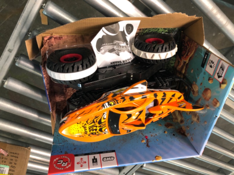 Photo 5 of Hot Wheels Monster Trucks, Remote Control Car, Monster Truck Toy with All-Terrain Wheels, 1:15 Scale Unstoppable Tiger Shark RC