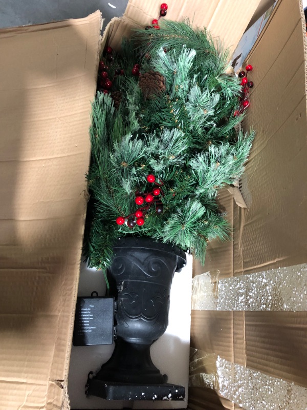 Photo 1 of Alupssuc 4ft Prelit Artificial Porch Christmas Tree Mini Entrances Potted Tree with Color LED Lights with Timer by Batteries Operated for Front Door, Entryway Xmas Home Decorations, 4 FT