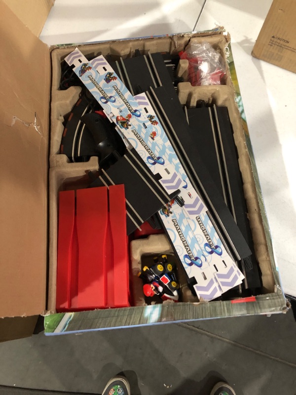 Photo 2 of Carrera GO!!! 63503 Official Licensed Mario Kart Battery Operated 1:43 Scale Slot Car Racing Toy Track Set with Jump Ramp Featuring Mario and Luigi 