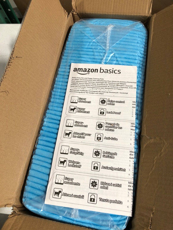 Photo 2 of Amazon Basics Dog and Puppy Pads, Leak-proof Pee Pads, 100CT