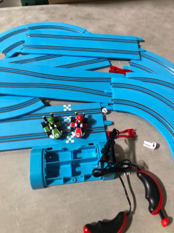 Photo 3 of Carrera First Nintendo Mario Kart Slot Car Race Track - Includes 2 Cars: Mario and Luigi and Two-Controllers - Battery-Powered Beginner Set for Kids Ages 3 Years and Up.