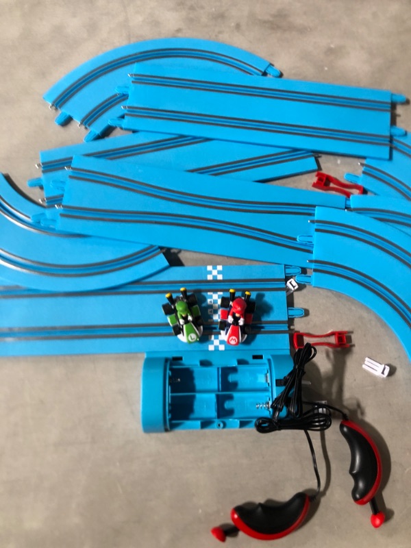 Photo 2 of Carrera First Nintendo Mario Kart Slot Car Race Track - Includes 2 Cars: Mario and Luigi and Two-Controllers - Battery-Powered Beginner Set for Kids Ages 3 Years and Up.