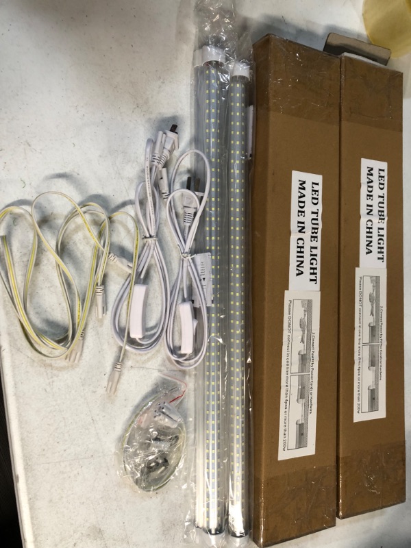 Photo 2 of *USED* 4 CT. LELEJU LED Shop Light 2ft, 3100lm, 6000K, 25W, Clear Cover, V-Shape, T8 LED Light Fixture and Linkable Tube Lights, Corded Electric with ON/Off Switch 