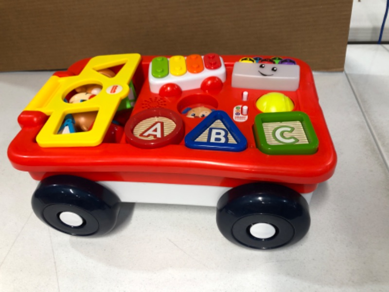 Photo 3 of Fisher-Price Laugh & Learn Pull & Play Learning Wagon, pull-toy wagon with music, lights, and learning songs for babies & toddlers ages 6-36 months