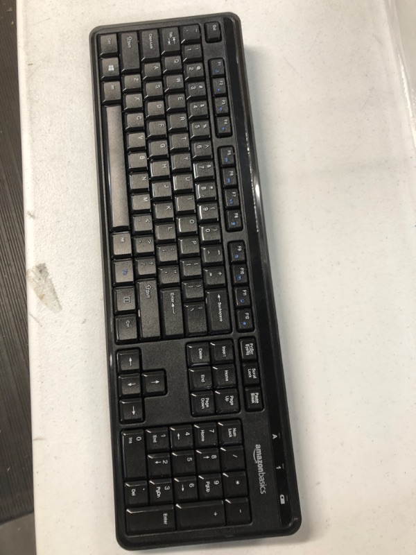 Photo 2 of Amazon Basics Wireless Keyboard-Quiet and Compact-US Layout 

missing stands ***