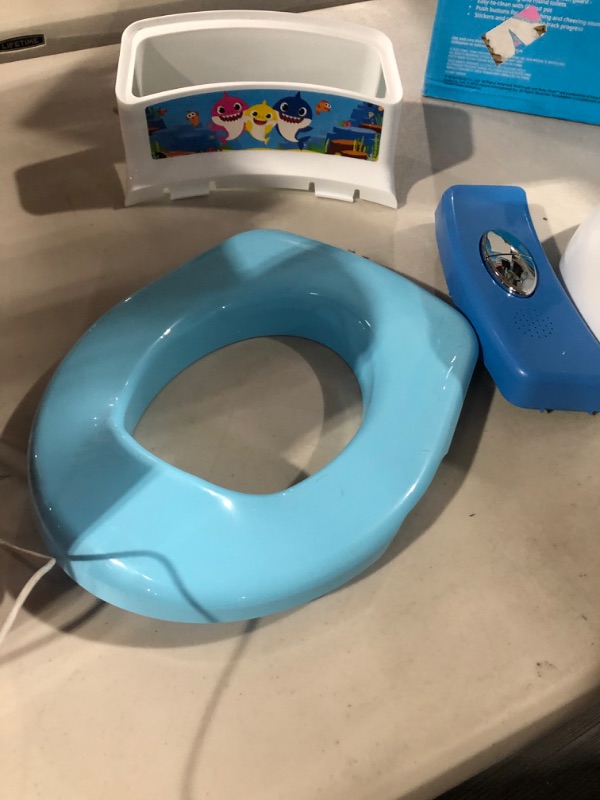 Photo 4 of **USED** The First Years Baby Shark Potty Training and Transitioning Seat