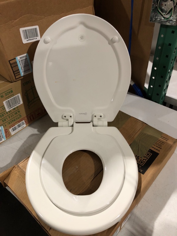 Photo 1 of MAYFAIR 888SLOW 000 NextStep2 Toilet Seat with Built-In Potty Training Seat, Slow-Close, Removable that will Never Loosen, ROUND, White 